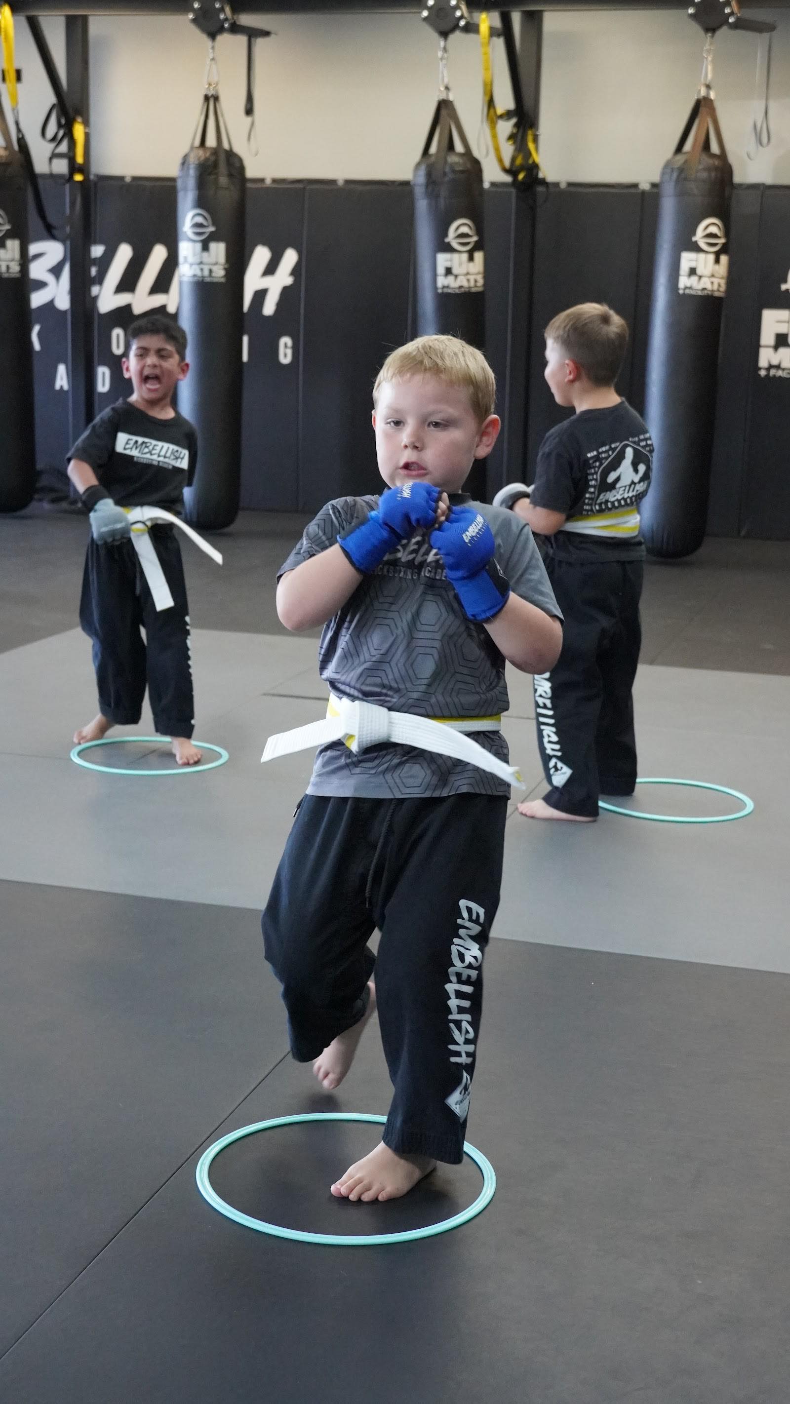 Mini Titans students practicing stance and technique at Embellish Kickboxing Academy in Elk Grove.